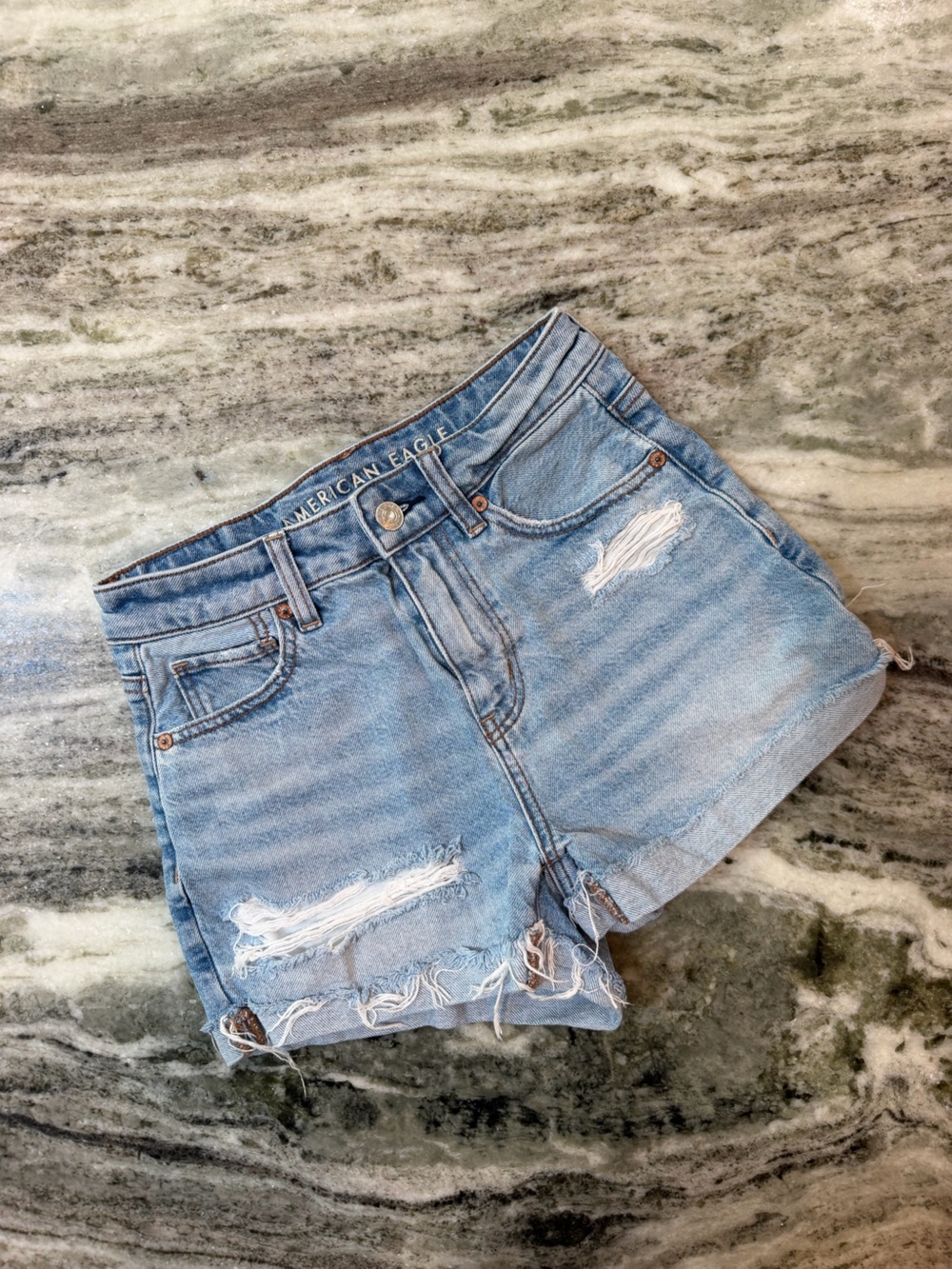 American Eagle “Mom Short” Light Blue Distressed Denim Shorts
Size 000